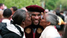 Photo of a graduate being congratulated by family members